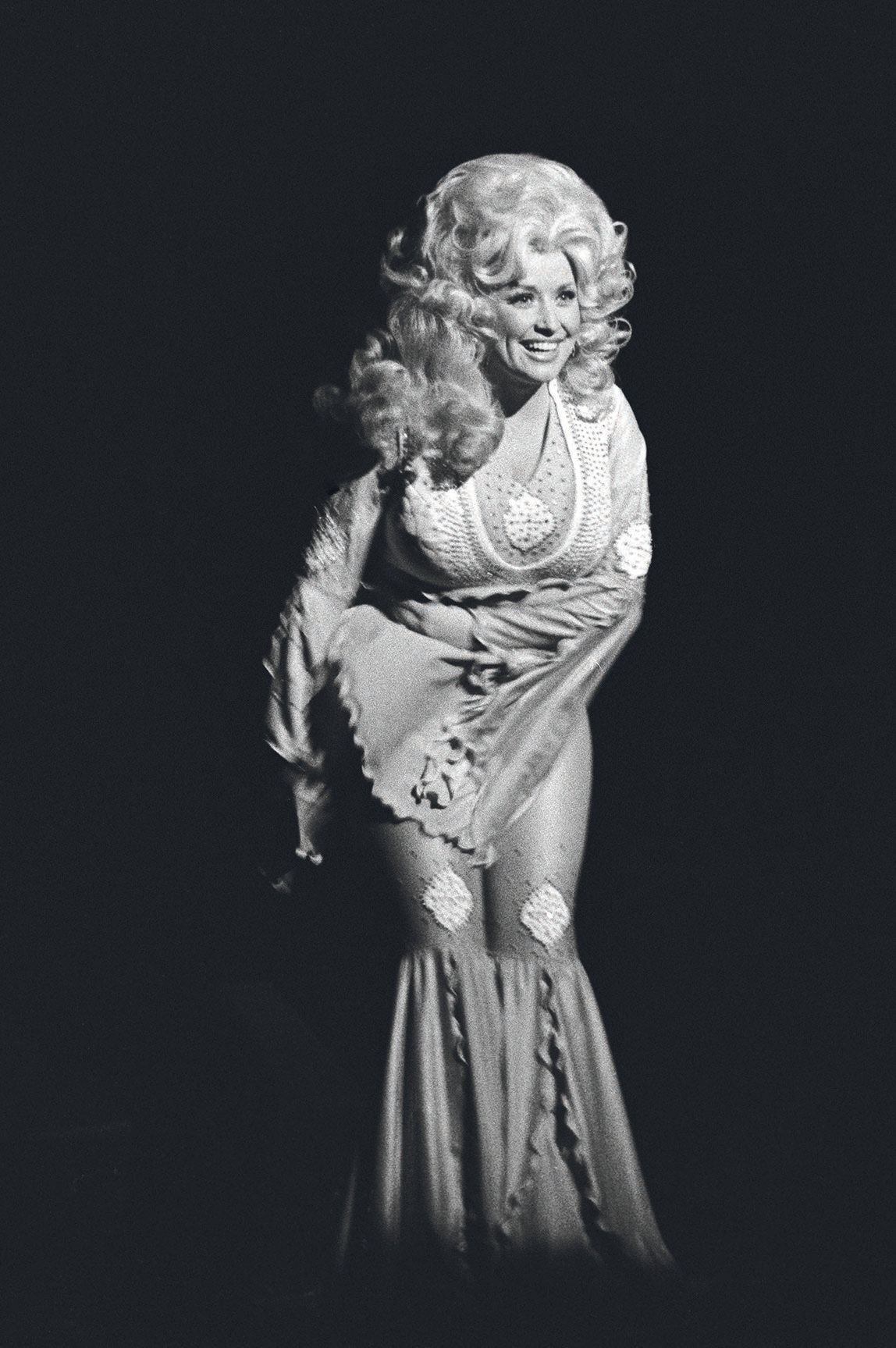 Dolly Parton performs live at The Paramount Theatre in 1977 in Oakland, California. PHOTO BY RICHARD MCCAFFREY FOR MICHAEL OCHS ARCHIVE/GETTY IMAGES